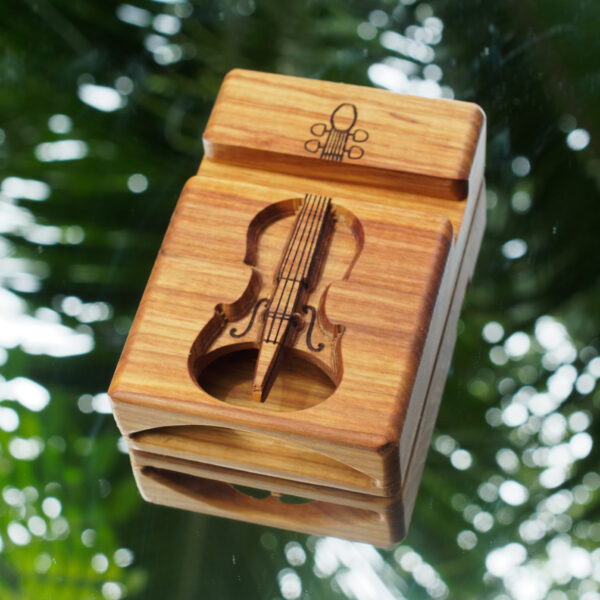 Canarywood speaker with a carved violin.