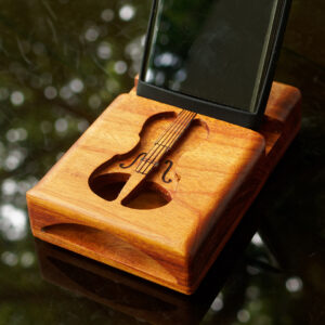 Macacauba wood speaker with a carved violin.
